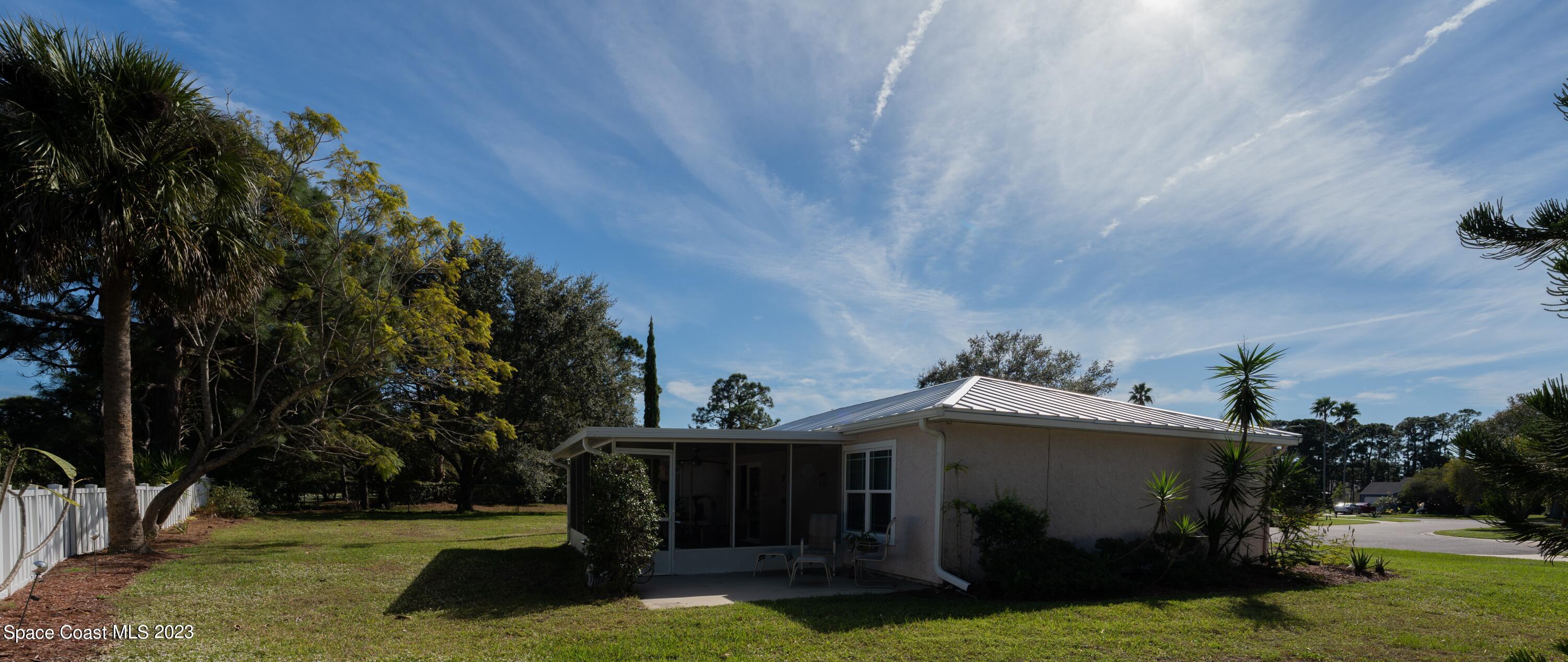 920 Gables Way Melbourne, FL 32940 - Photo 6 of 24 a front view of a house with garden