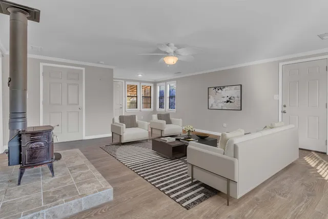 a living room with furniture and a window