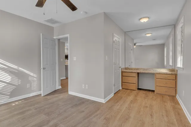 a bedroom with bed and a window