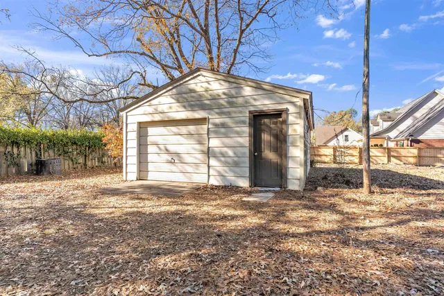 a view of a room with wooden walls