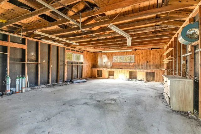 a view of a yard with a house and a tree