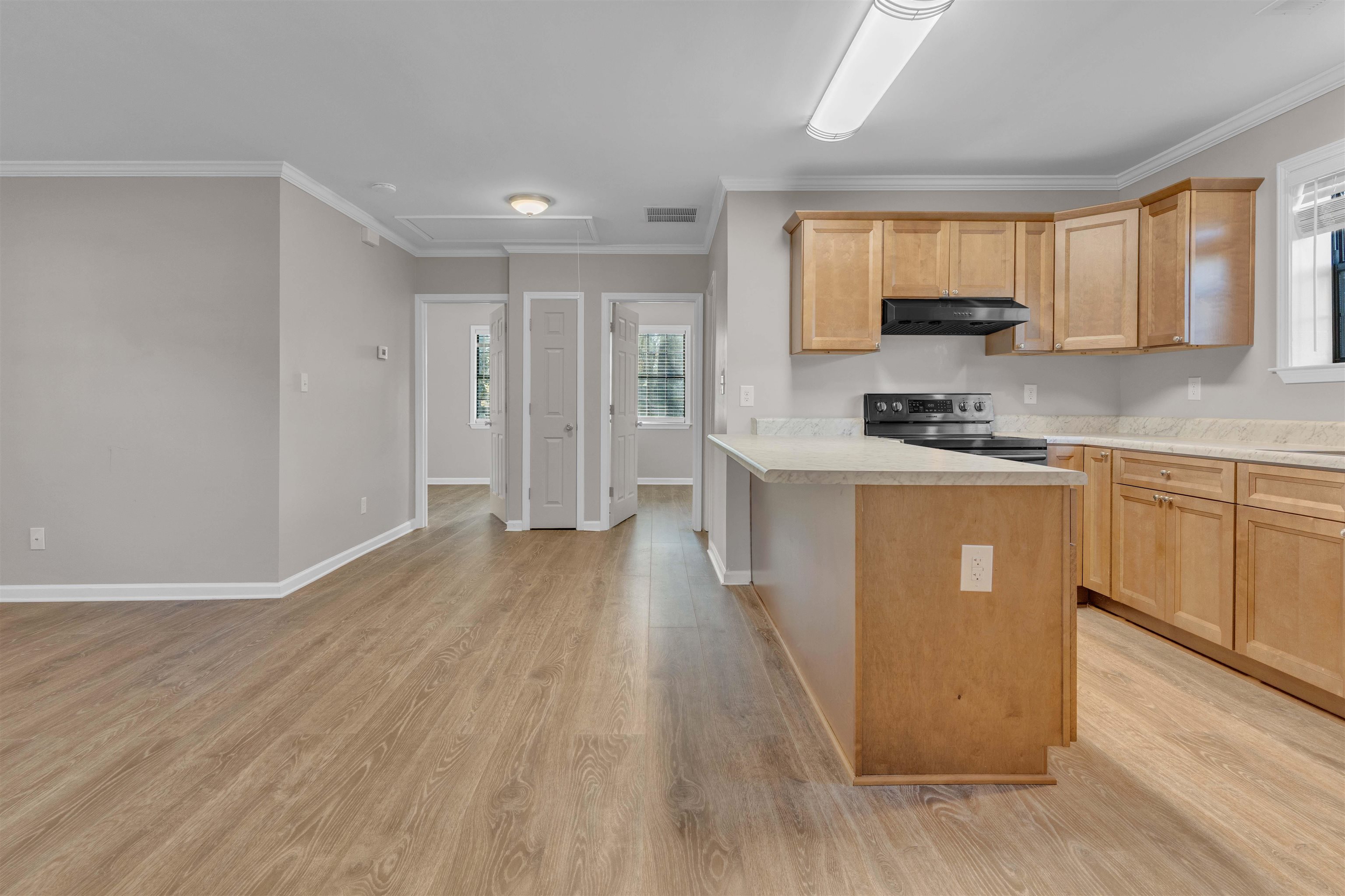 4163 Fonta Road Bartlett, TN 38002 - Photo 6 of 27 a kitchen with stainless steel appliances granite countertop a stove top oven a sink dishwasher and a refrigerator with wooden floor