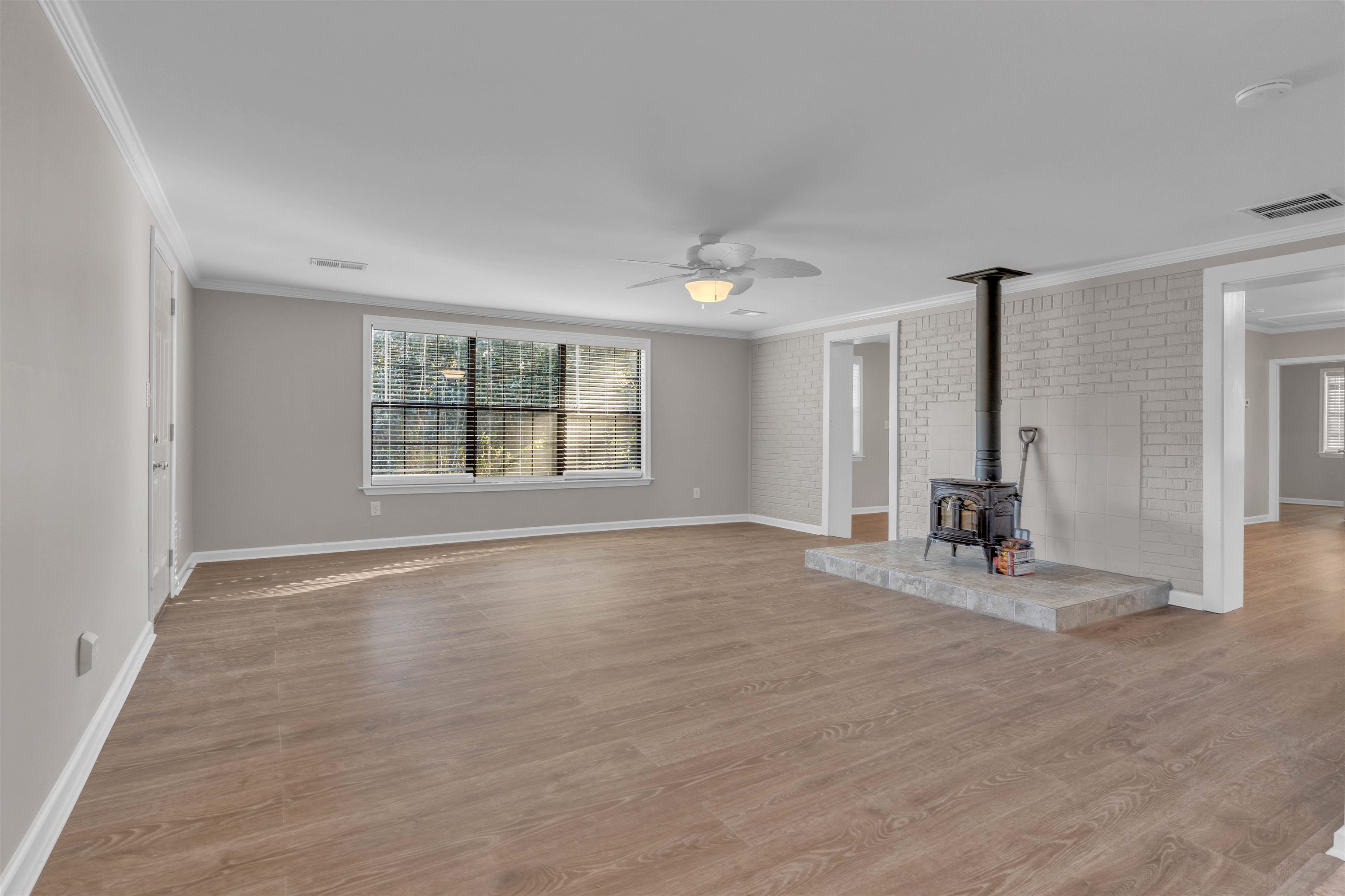 4163 Fonta Road Bartlett, TN 38002 - Photo 10 of 27 an empty room with wooden floor and windows