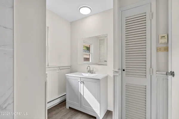 a bathroom with a sink and a mirror