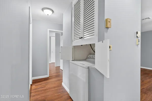 a kitchen with a refrigerator and a sink