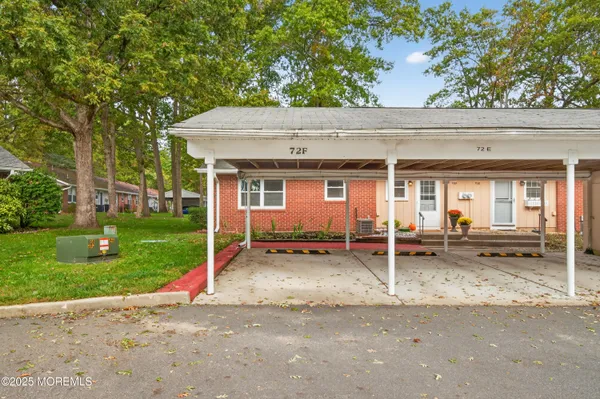 a backyard of a house with yard and garage