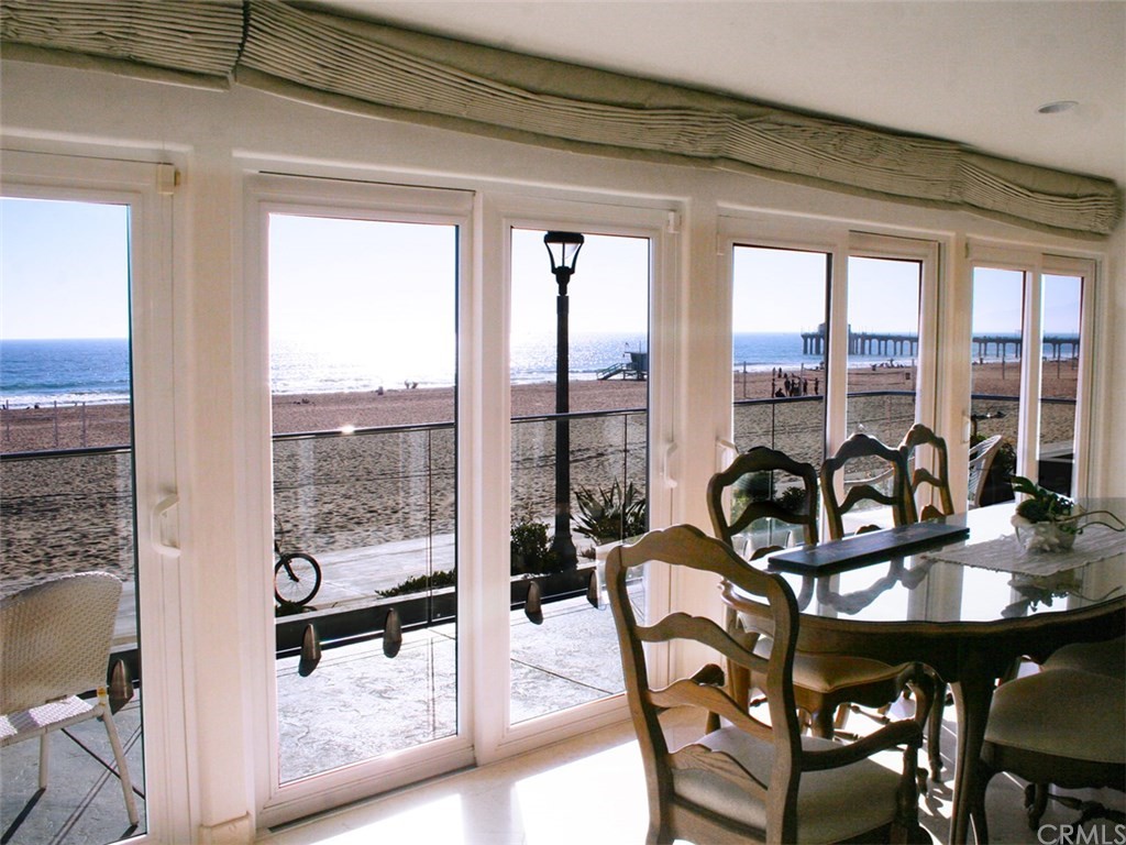 614 The Strand Manhattan Beach, CA 90266 - Photo 13 of 41 a view of a city from a dining room with furniture and window