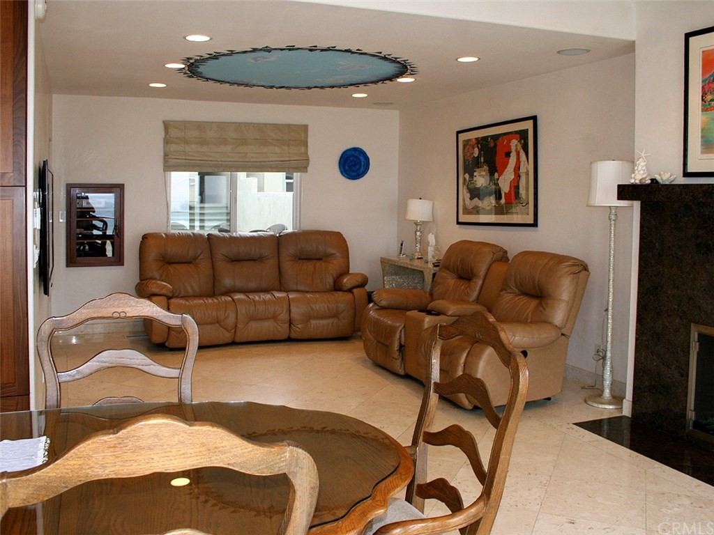 614 The Strand Manhattan Beach, CA 90266 - Photo 16 of 41 a living room with furniture and a flat screen tv