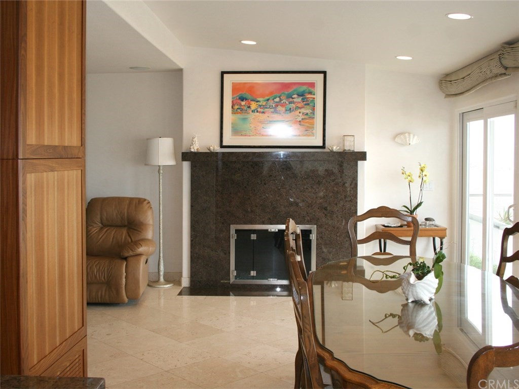 614 The Strand Manhattan Beach, CA 90266 - Photo 19 of 41 a living room with furniture and a fireplace