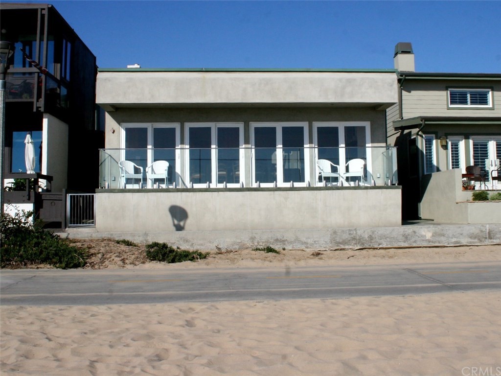 614 The Strand Manhattan Beach, CA 90266 - Photo 2 of 41 front view of a house with a yard