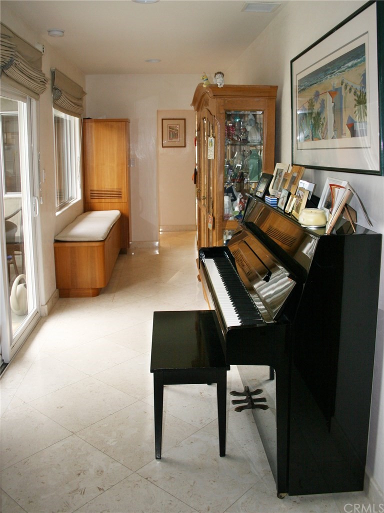 614 The Strand Manhattan Beach, CA 90266 - Photo 21 of 41 a living room with furniture and a large window