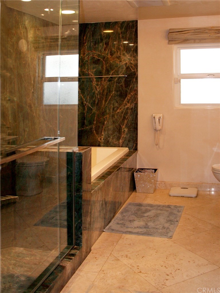 614 The Strand Manhattan Beach, CA 90266 - Photo 24 of 41 a bathroom with a shower and a sink