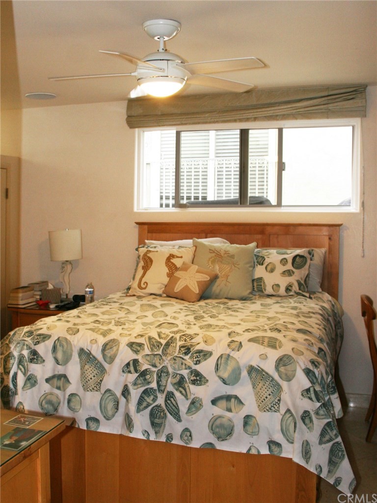 614 The Strand Manhattan Beach, CA 90266 - Photo 28 of 41 a bedroom with a large bed and a window