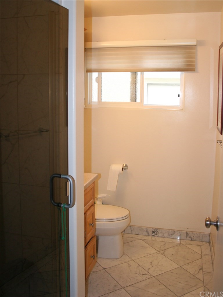 614 The Strand Manhattan Beach, CA 90266 - Photo 29 of 41 a white toilet sitting next to a window