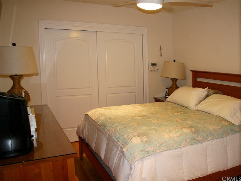 614 The Strand Manhattan Beach, CA 90266 - Photo 32 of 41 a bedroom with a bed and a flat tv screen on the dresser
