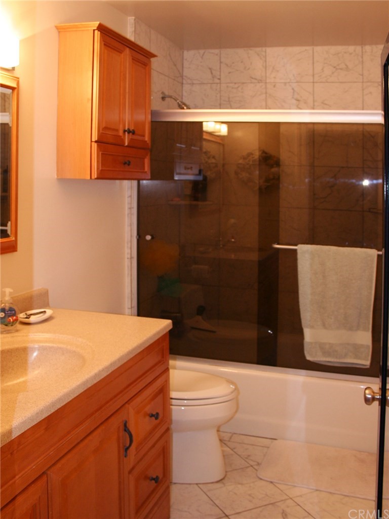 614 The Strand Manhattan Beach, CA 90266 - Photo 33 of 41 a bathroom with a sink a toilet and shower