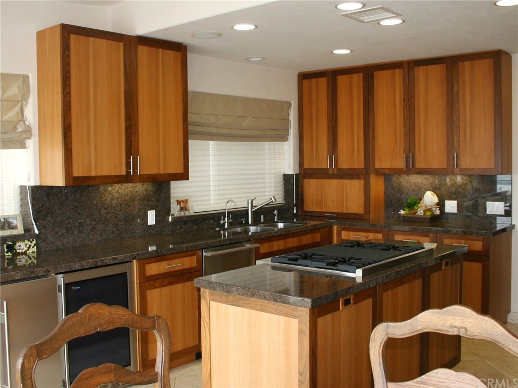 614 The Strand Manhattan Beach, CA 90266 - Photo 7 of 41 a kitchen that has a sink and a stove in it