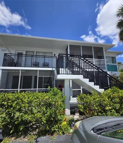 front view of a house with a garden