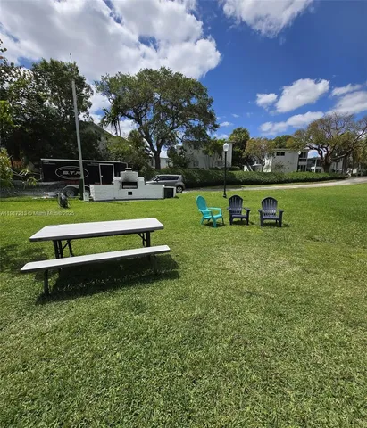 a view of a park with large trees