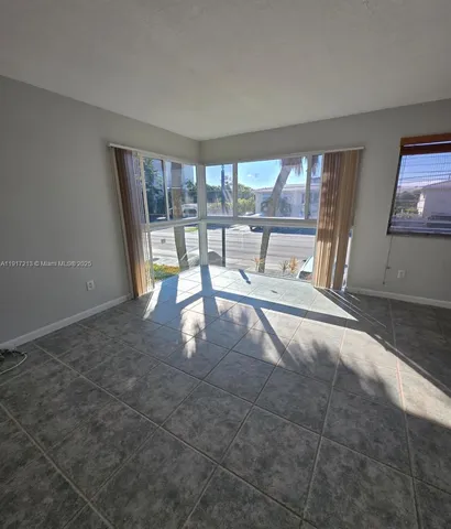 a view of an empty room and window