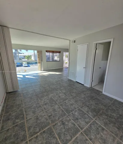 a view of livingroom with furniture and window