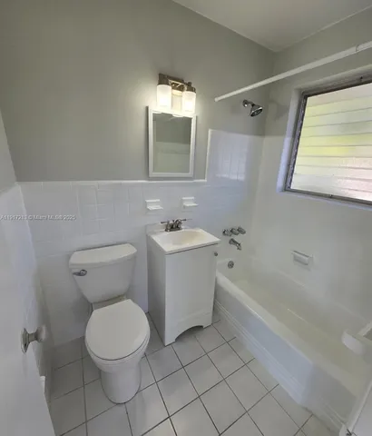 a bathroom with a toilet sink and bathtub