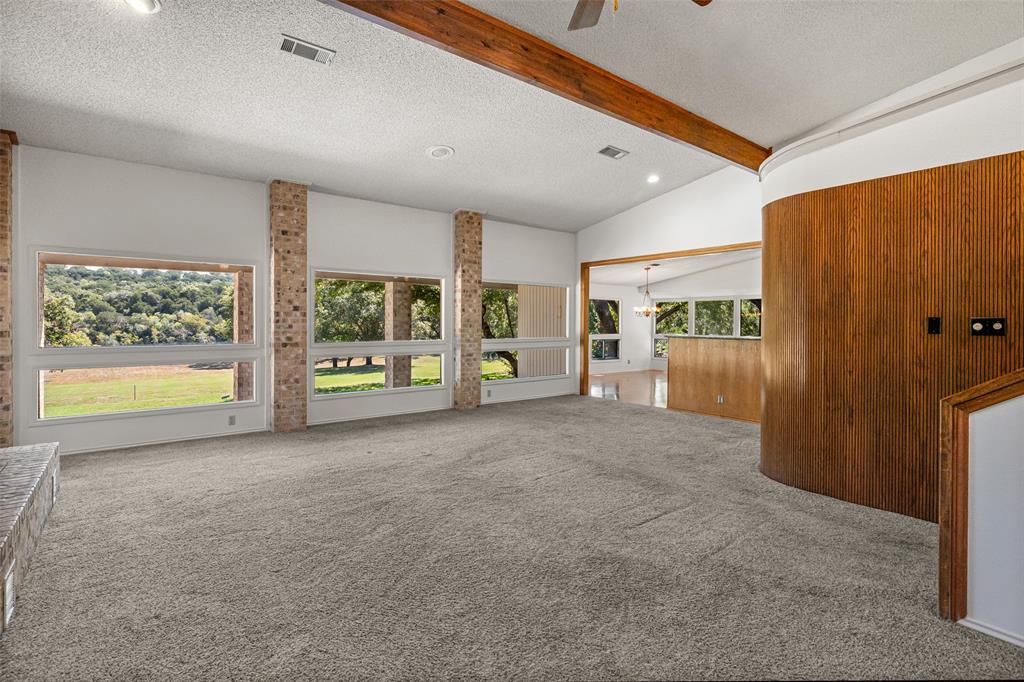 7508 Ravenswood Road Granbury, TX 76049 - Photo 11 of 40 a view of an empty room with a window