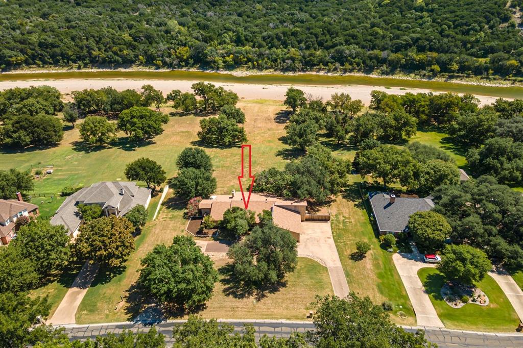 7508 Ravenswood Road Granbury, TX 76049 - Photo 3 of 40 an aerial view of residential houses with outdoor space