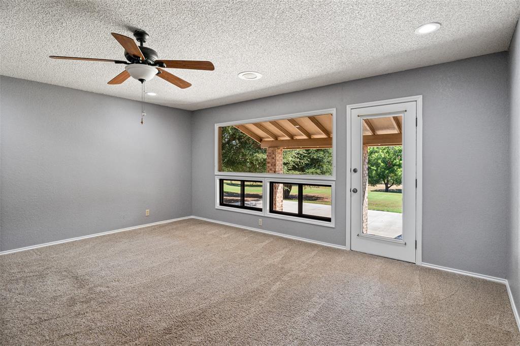 7508 Ravenswood Road Granbury, TX 76049 - Photo 32 of 40 a view of an empty room with a window