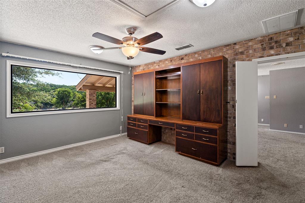 7508 Ravenswood Road Granbury, TX 76049 - Photo 36 of 40 wooden floor in an empty room with a window