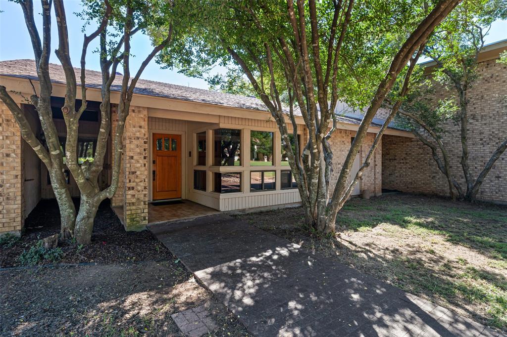 7508 Ravenswood Road Granbury, TX 76049 - Photo 4 of 40 a view of a yard with a tree