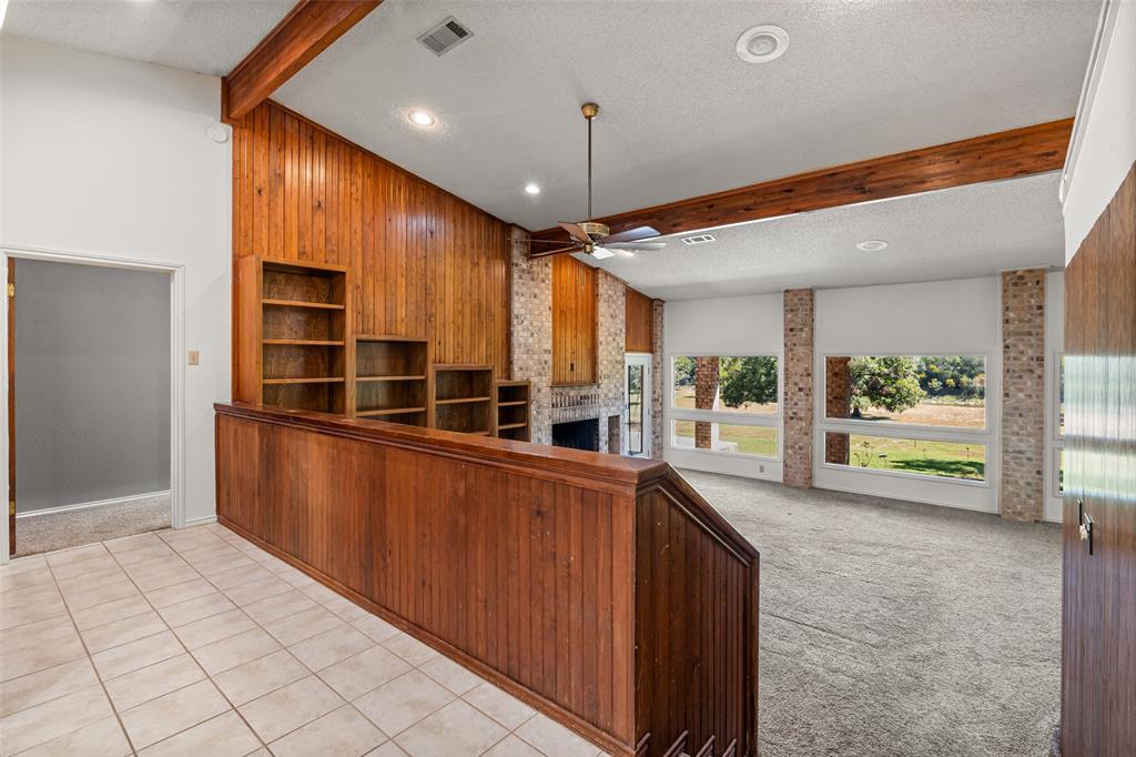 7508 Ravenswood Road Granbury, TX 76049 - Photo 8 of 40 a view of a kitchen with furniture and a window