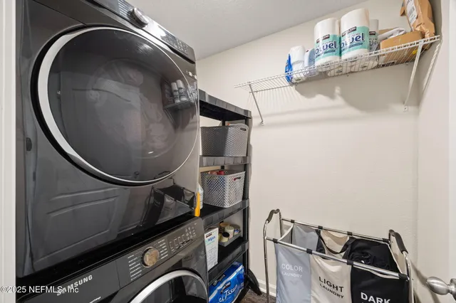 a big yard with lots of green space and building in the back