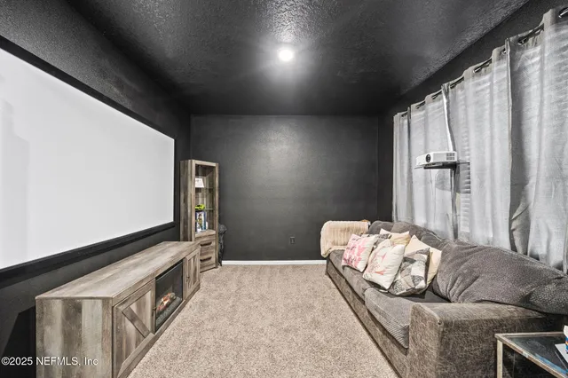 a bedroom with bed and window