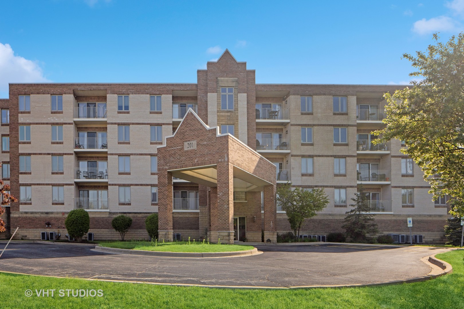 201 West Brush Hill Road, Unit 102 Elmhurst, IL 60126 - Photo 1 of 18 a front view of a building