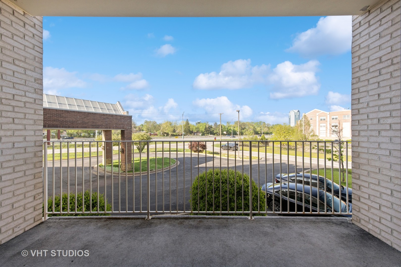 201 West Brush Hill Road, Unit 102 Elmhurst, IL 60126 - Photo 3 of 18 a view of a balcony with city