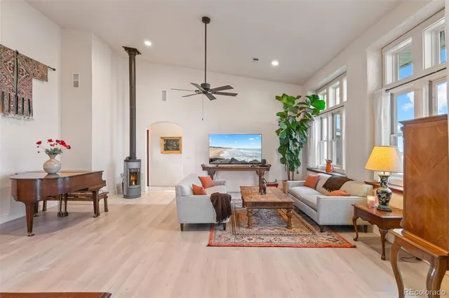 a living room with furniture and a chandelier