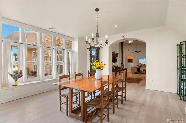 a view of a dining room with furniture and window
