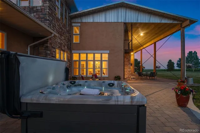 a view of patio with a table and chairs