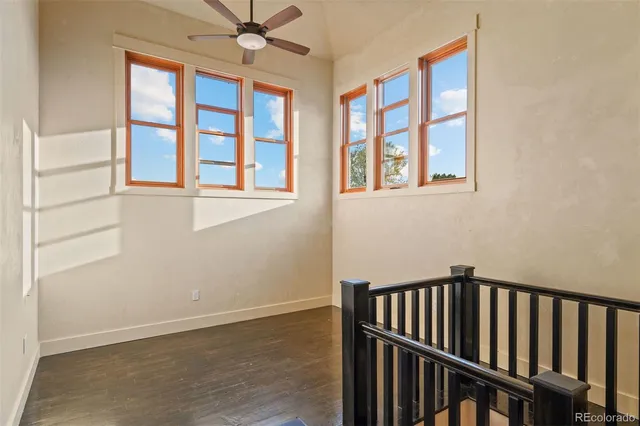 a view of staircase with wooden floor