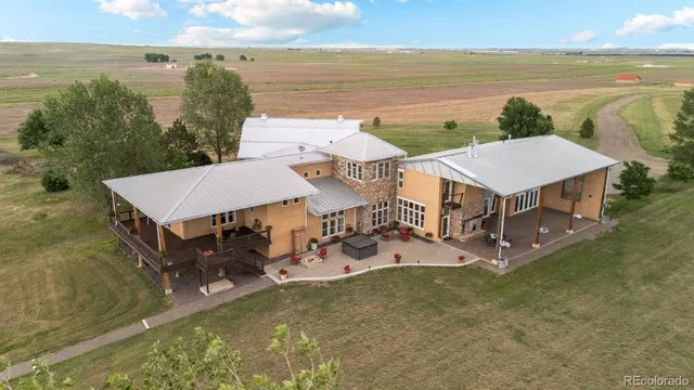 a view of a lake with furniture