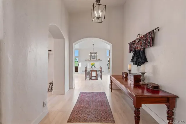 a hallway with a view of living room