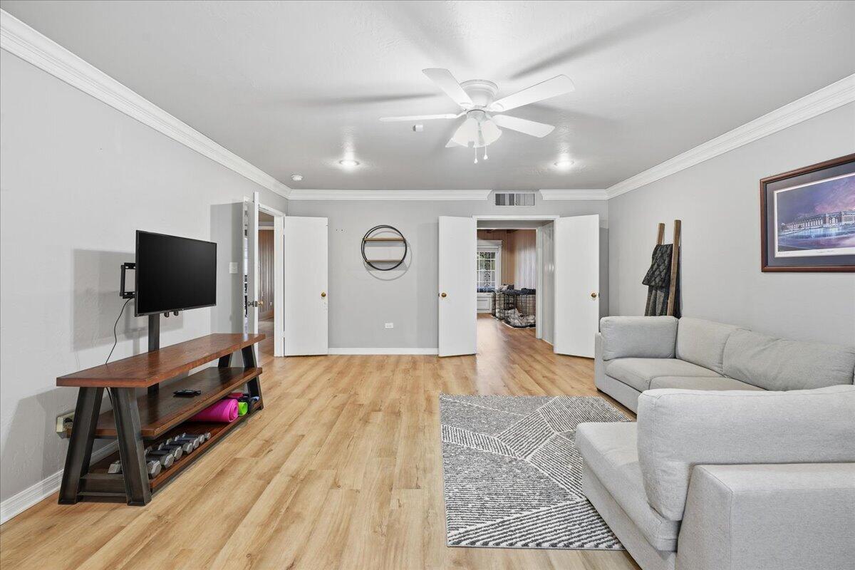 3607 27th Street Lubbock, TX 79410 - Photo 12 of 30 a living room with furniture and a flat screen tv