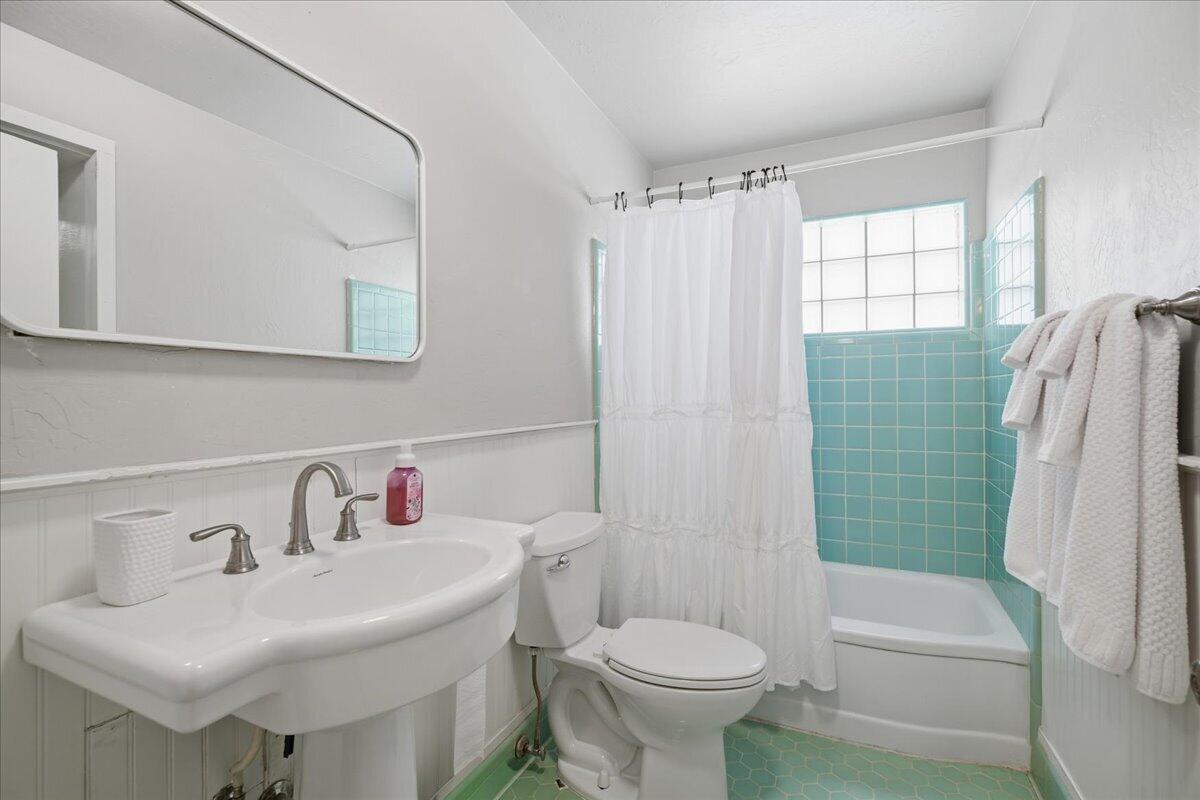 3607 27th Street Lubbock, TX 79410 - Photo 23 of 30 a bathroom with a sink toilet and shower