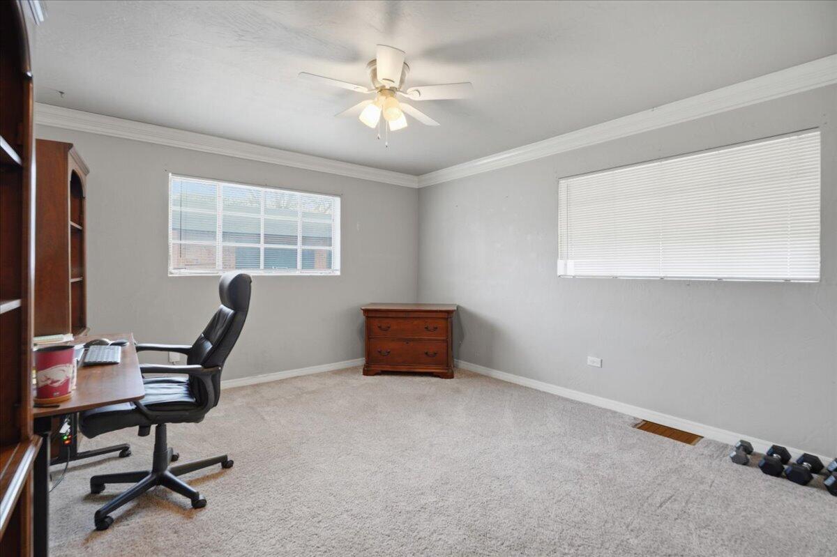 3607 27th Street Lubbock, TX 79410 - Photo 24 of 30 a workspace with furniture and a window