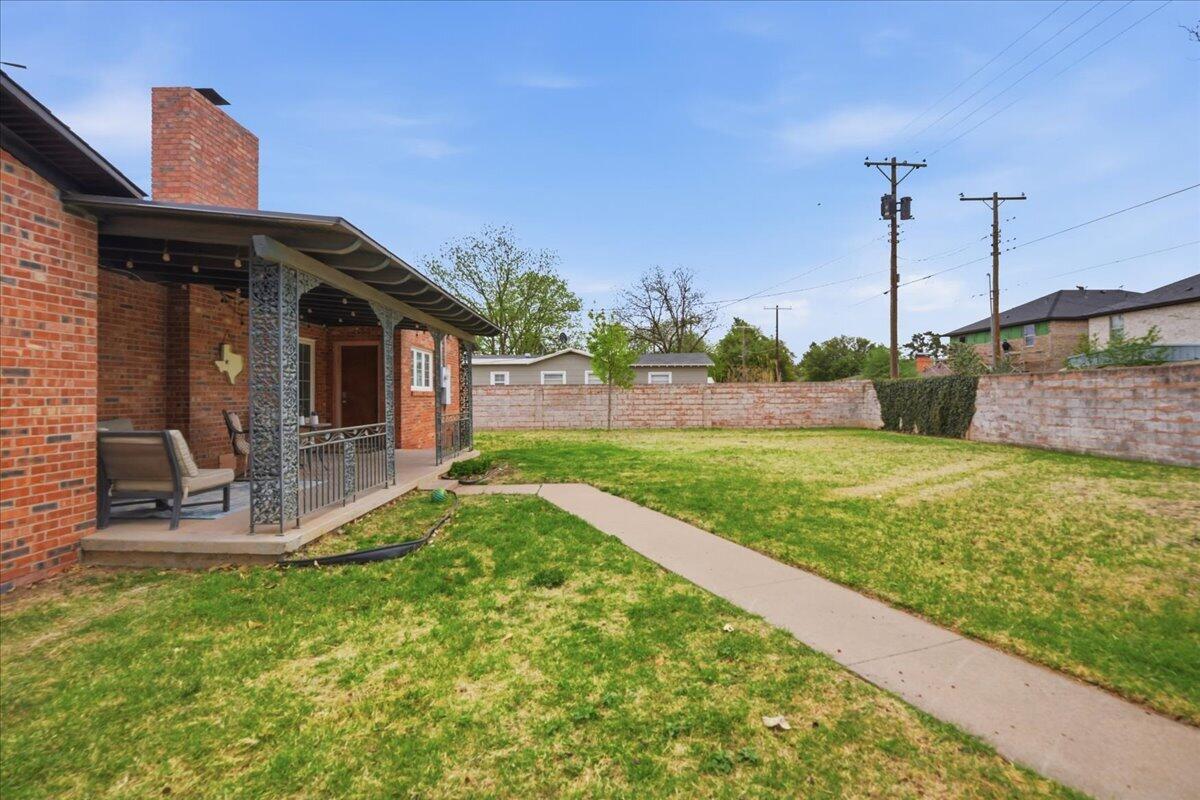 3607 27th Street Lubbock, TX 79410 - Photo 26 of 30 a view of a house with a backyard