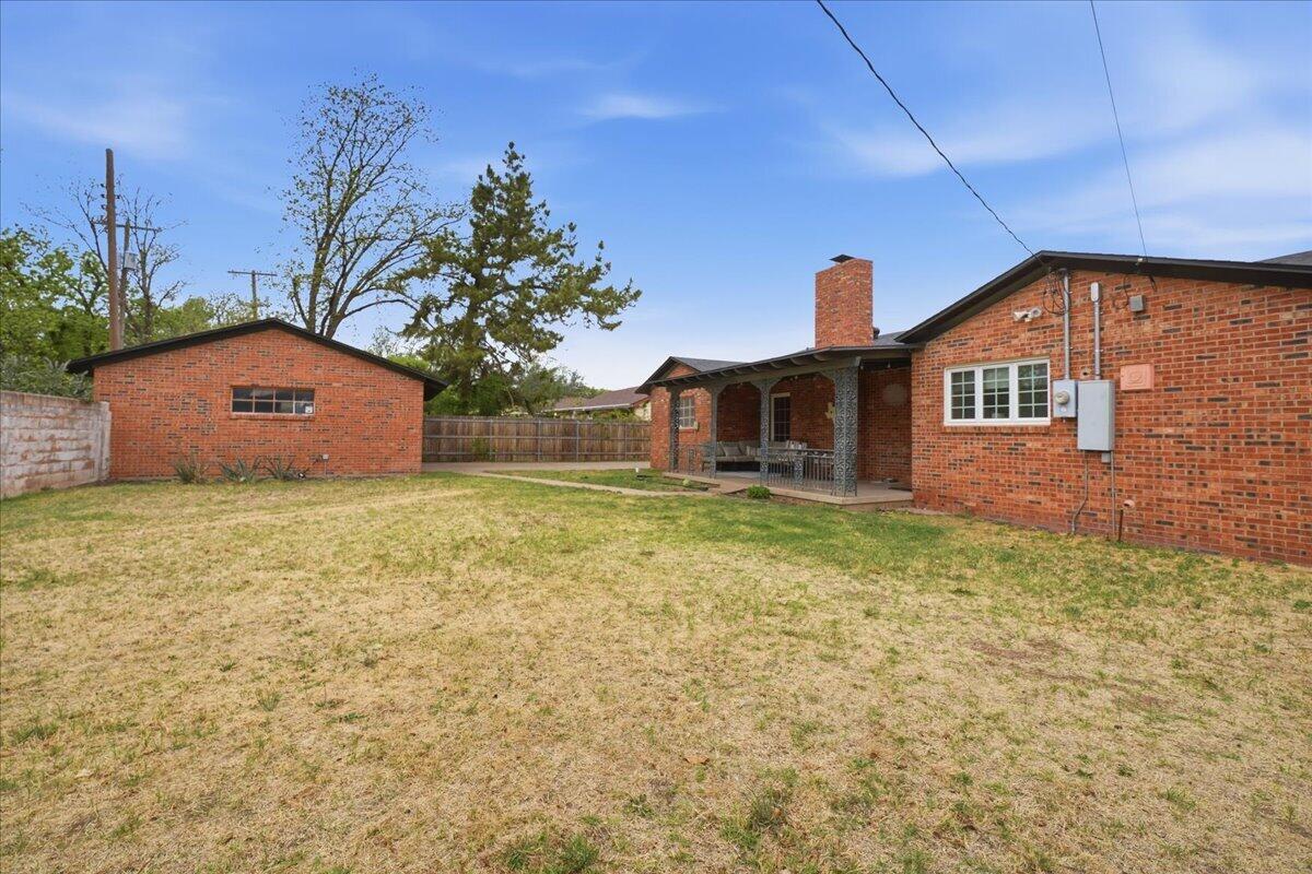 3607 27th Street Lubbock, TX 79410 - Photo 28 of 30 a front view of a house with a yard