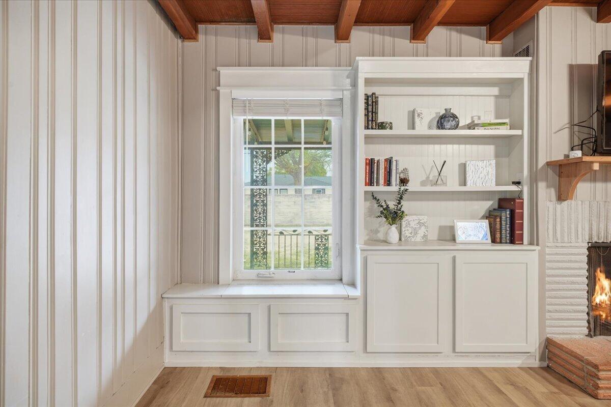 3607 27th Street Lubbock, TX 79410 - Photo 8 of 30 a view of a kitchen that has a lot of cabinets and a window