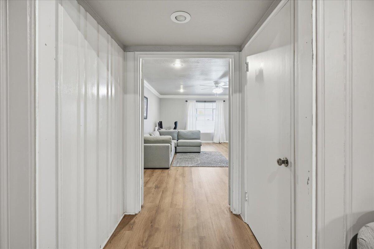 3607 27th Street Lubbock, TX 79410 - Photo 9 of 30 a view of a hallway with wooden floor windows and livingroom view