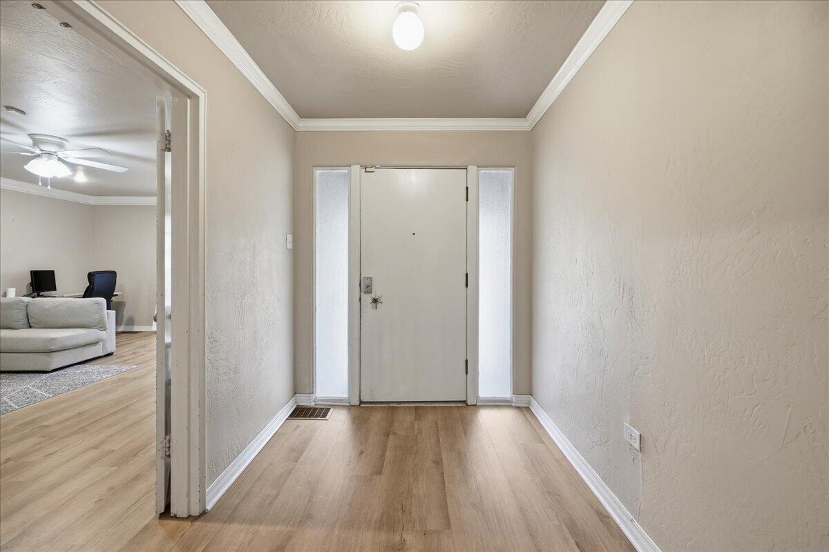 3607 27th Street Lubbock, TX 79410 - Photo 10 of 30 a view of a livingroom with wooden floor and furniture